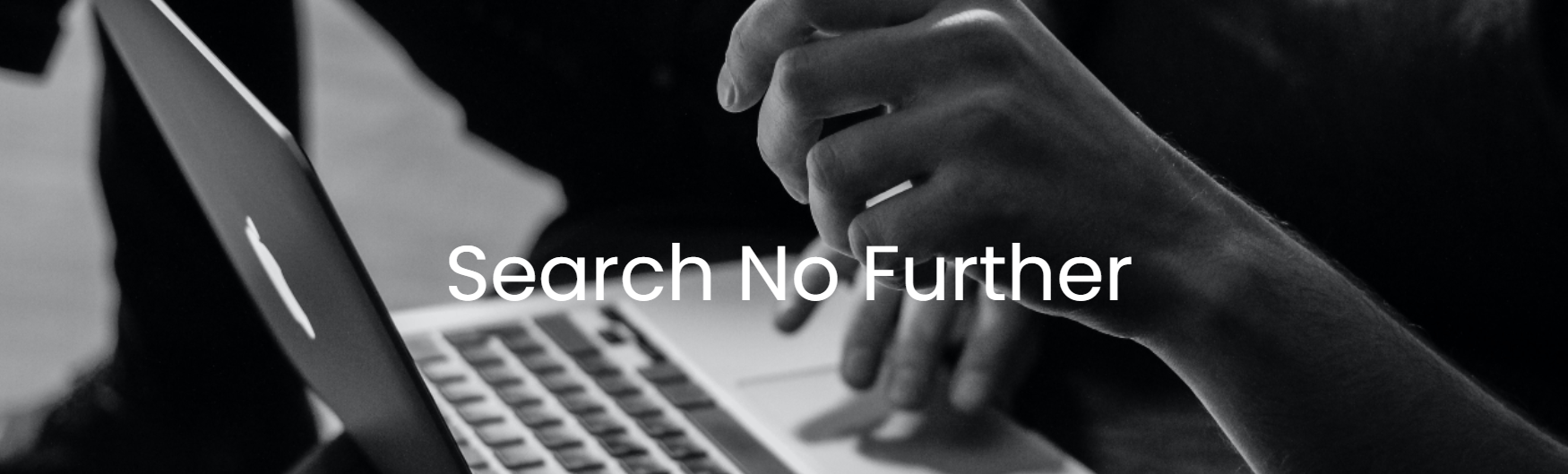 Person's hands using a laptop, text