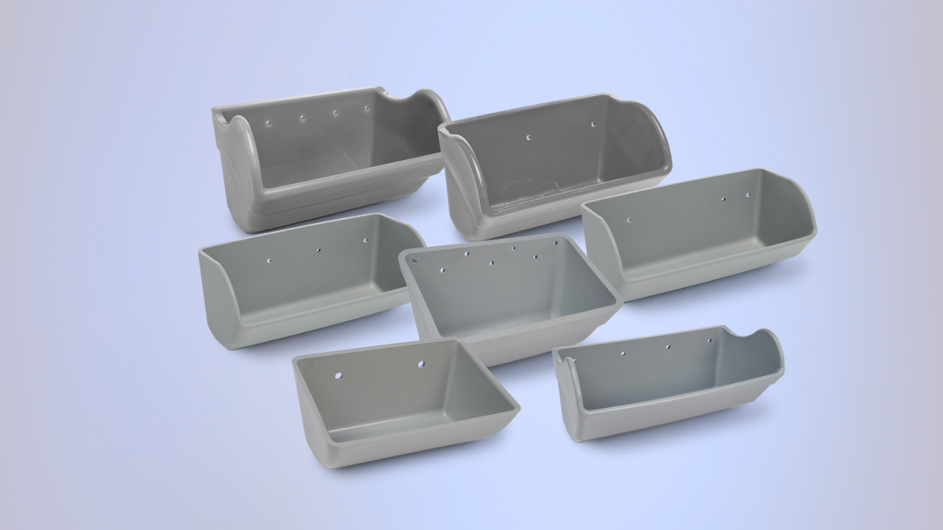 Seven light-gray, nylon elevator buckets, arranged in a group against a light background.