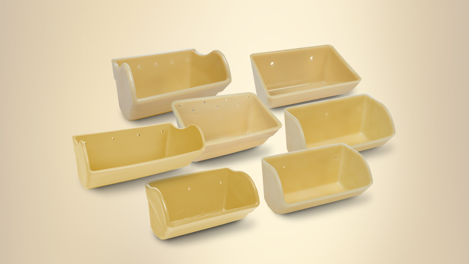 Seven small, rectangular, beige nylon elevator buckets, arranged on a light background.