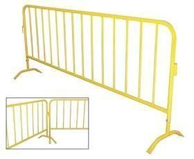 Yellow metal crowd control barrier with feet.