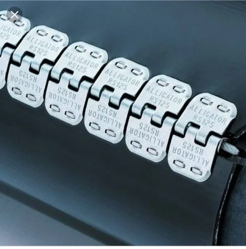 Close-up of a black conveyor belt connected with silver alligator RS125 fasteners.