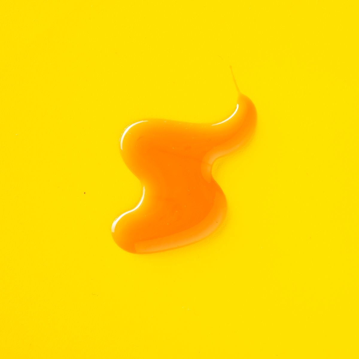 Mox skincare beauty face mask swatch on yellow paper in squiggle shape. By commercial product photographers at JAM Creative.