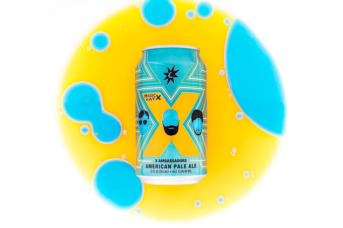 Beverage product photography of Magic Hat X Ambassador beer on a circle of blue + yellow. Product photographers: JAM Creative