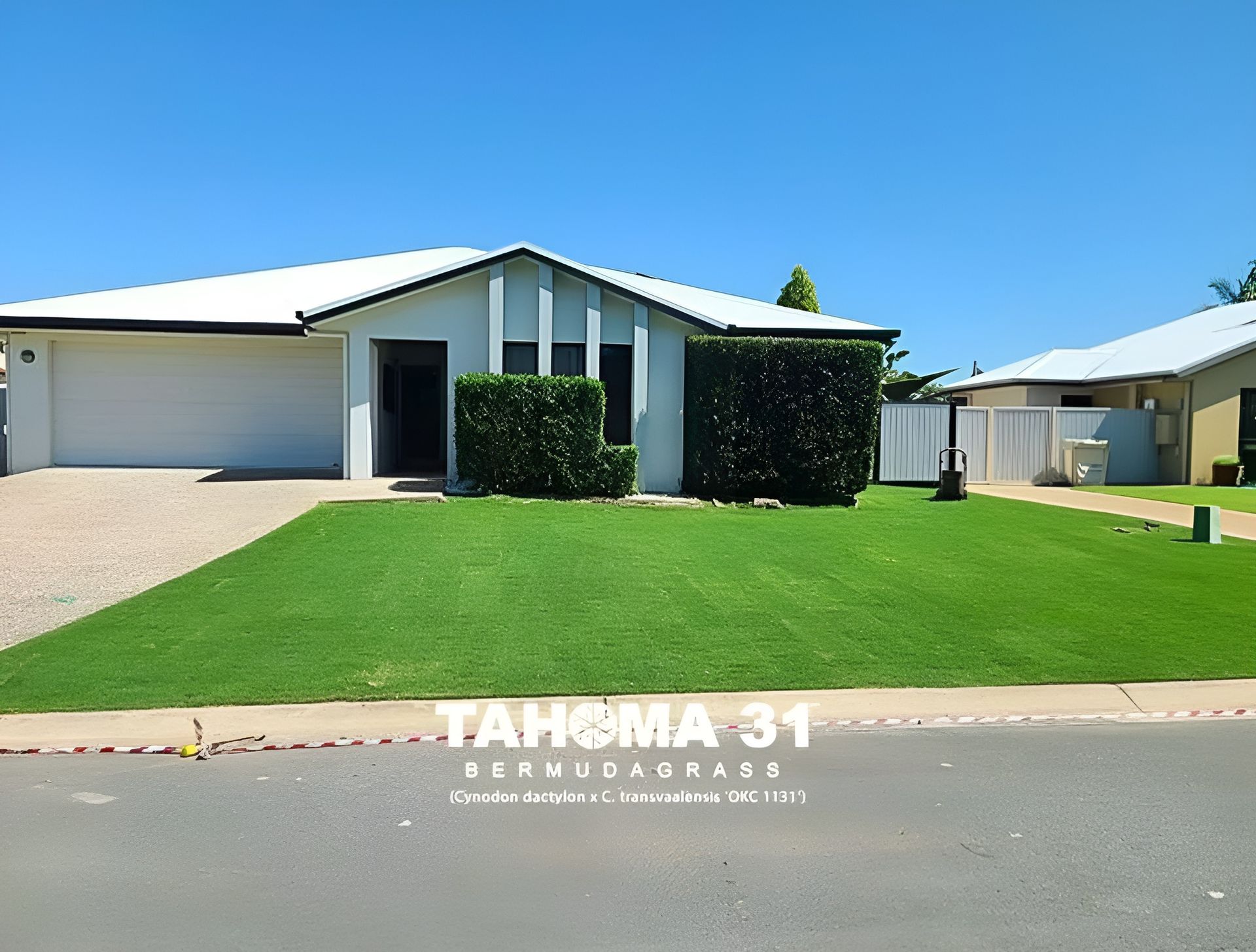 House with White Roof, Garage, and Green Lawn on A Sunny Day — Top Notch Turf in Ayr, QLD