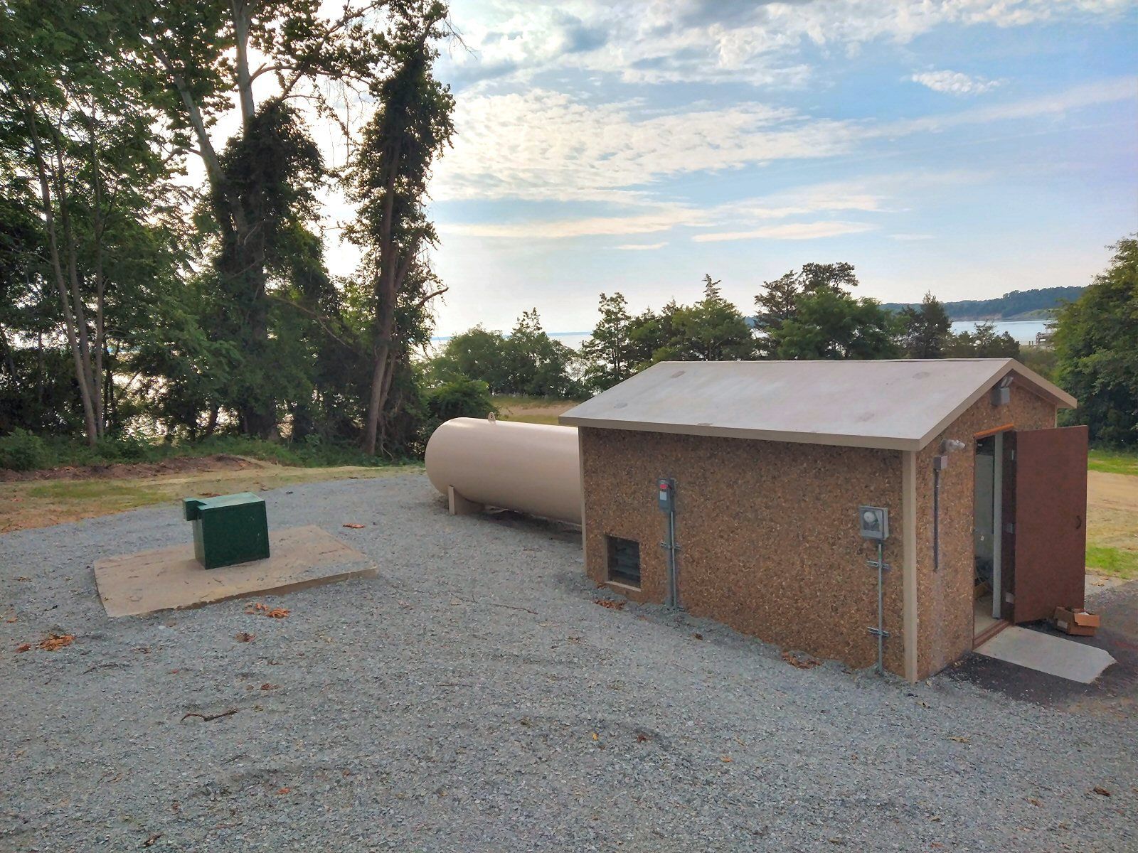 A shed with a propane tank next to it
