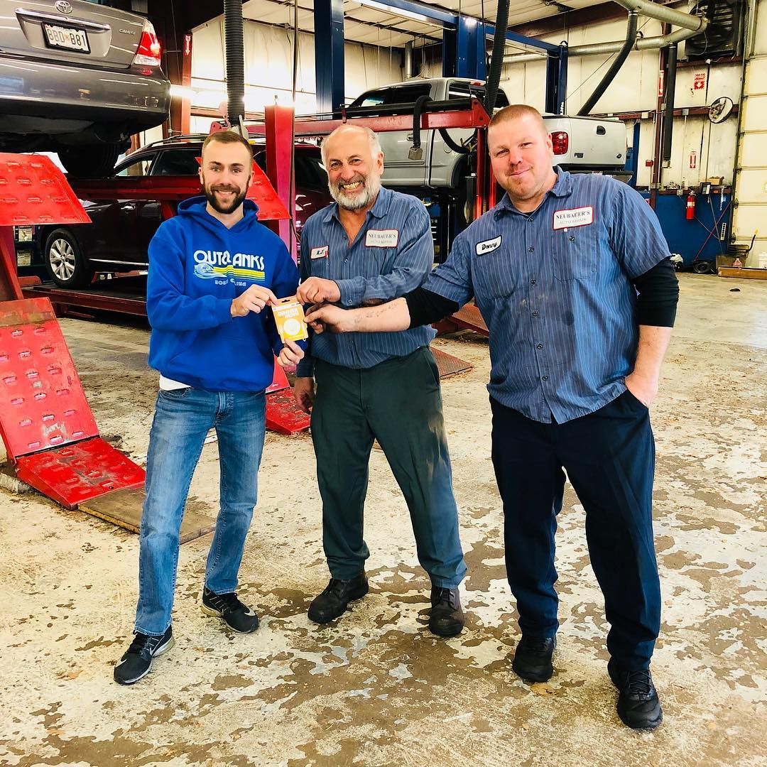 Neubauer’s Auto Repair Team Members Standing Inside Service Bay | Neubauer's Auto Repair