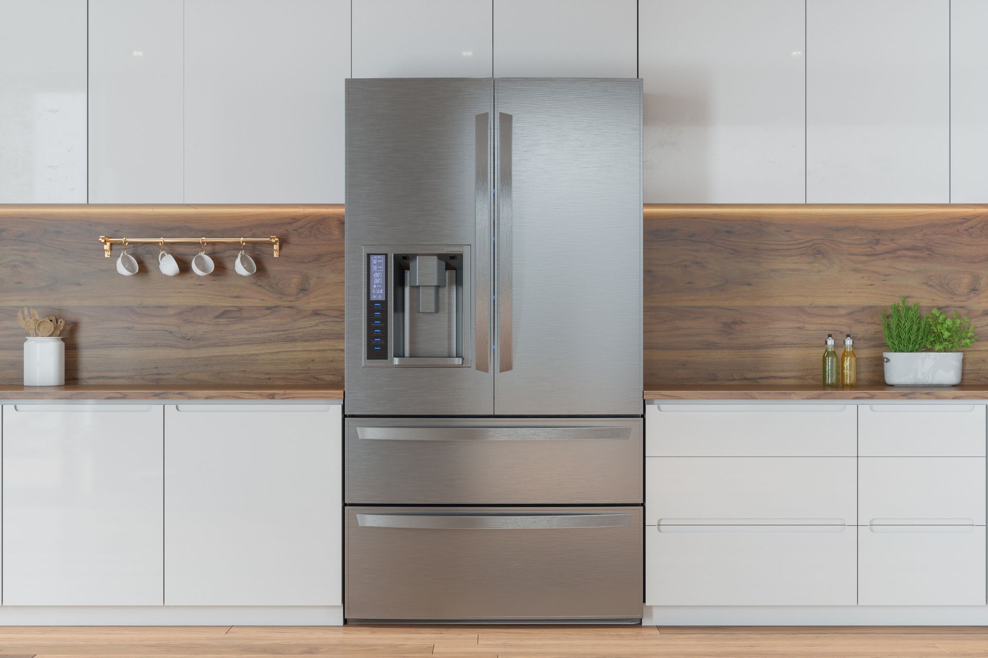 A kitchen with white cabinets and a stainless steel refrigerator.