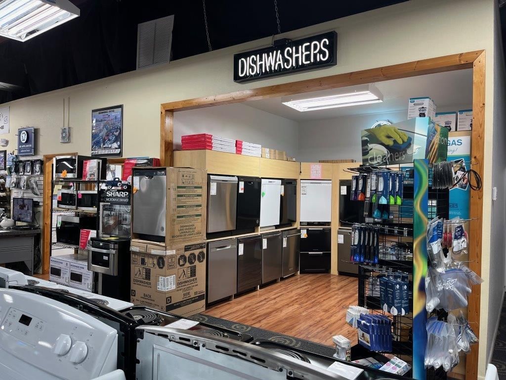 A kitchen with a stove top oven and a microwave.