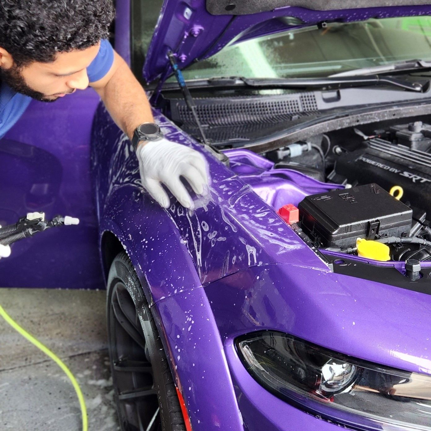 Dodge Charger receiving Paint Protection Film (PPF) installation by CarZmedics, ensuring premium paint protection and durability.