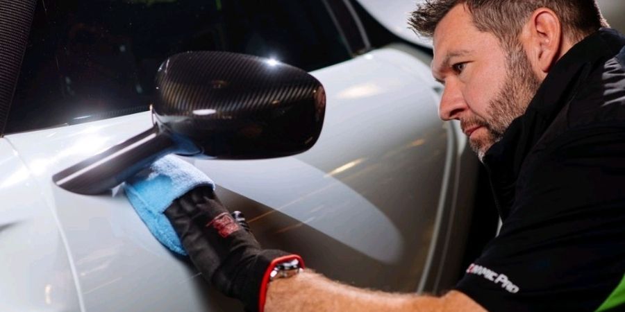 A certified ceramic coating professional applying ceramic coating