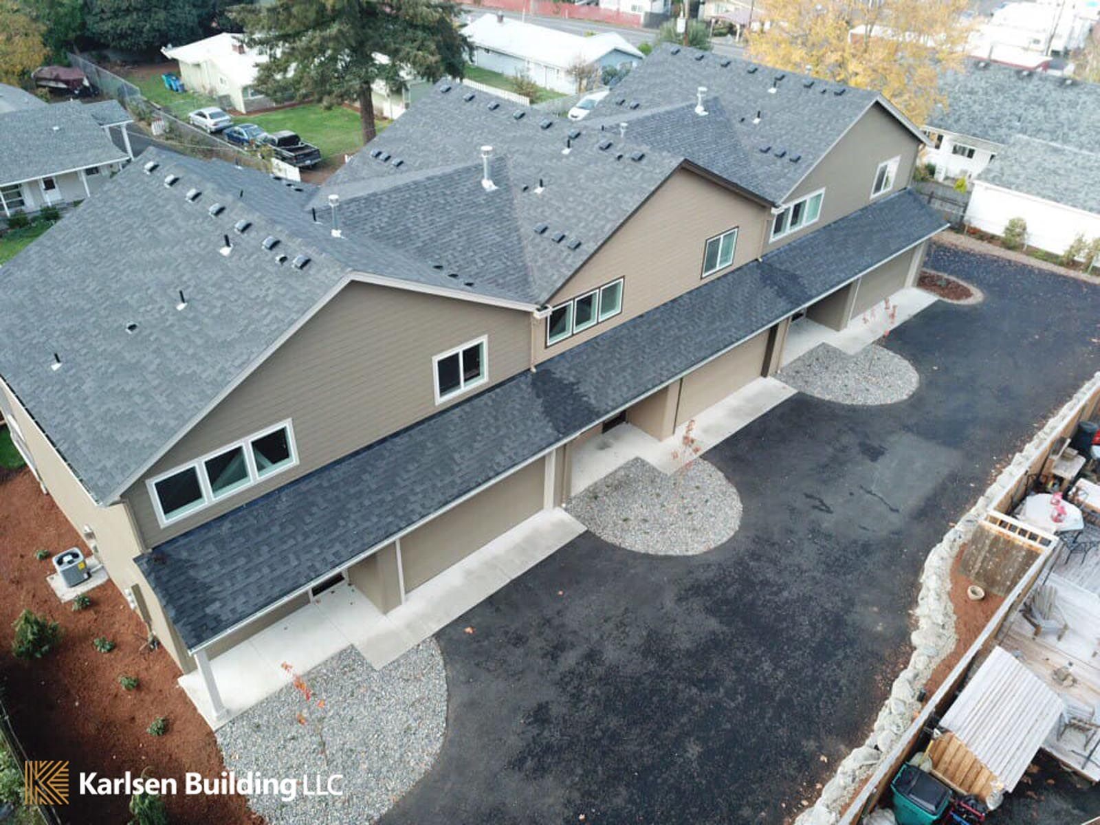 An aerial view of a row of apartment buildings by karlsen building llc