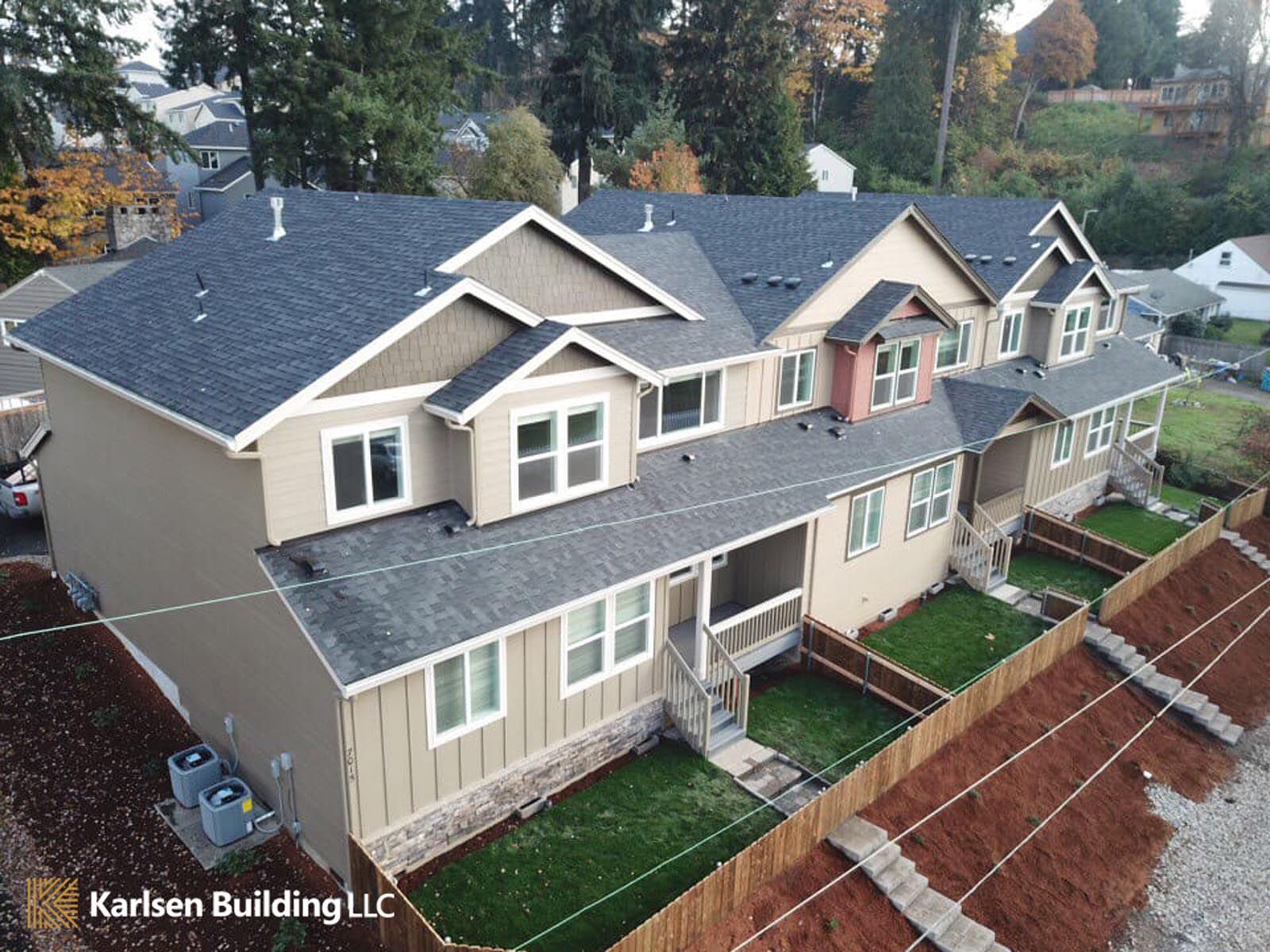 An aerial view of a row of houses by karlsen building llc