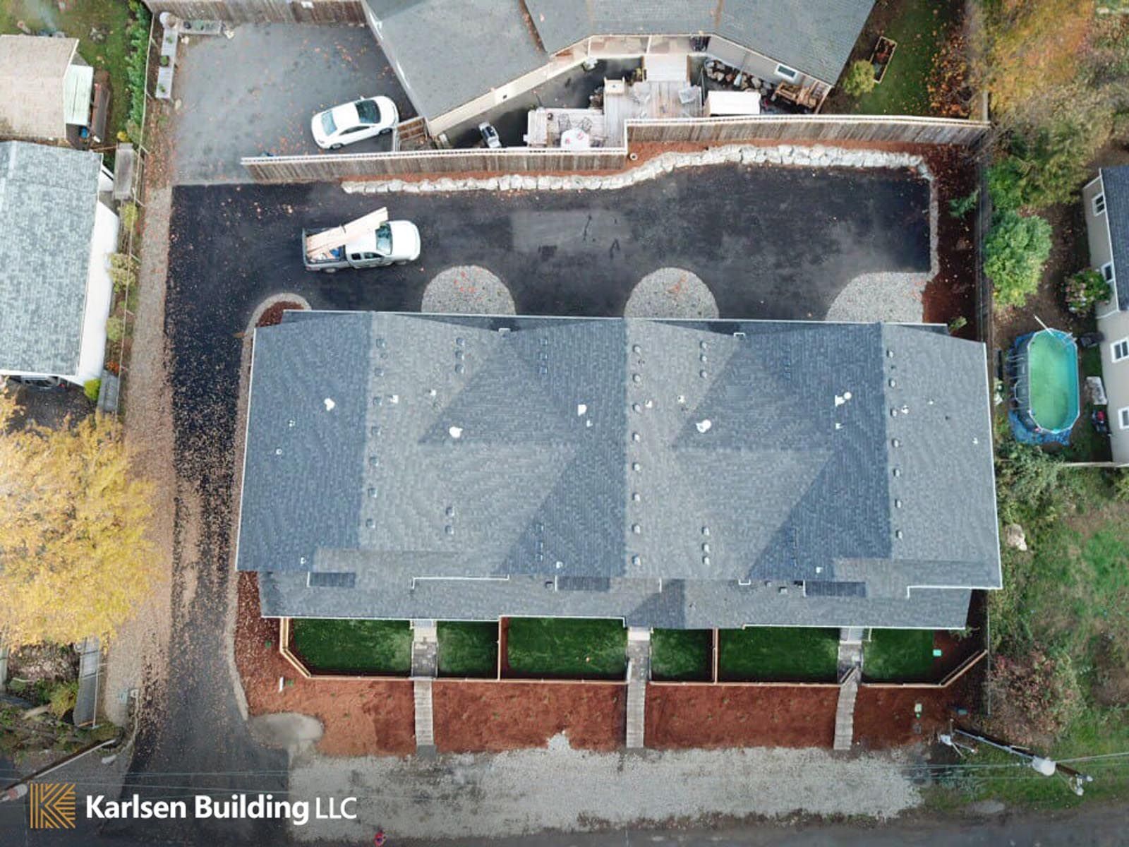 An aerial view of a row of houses by karlsen building llc