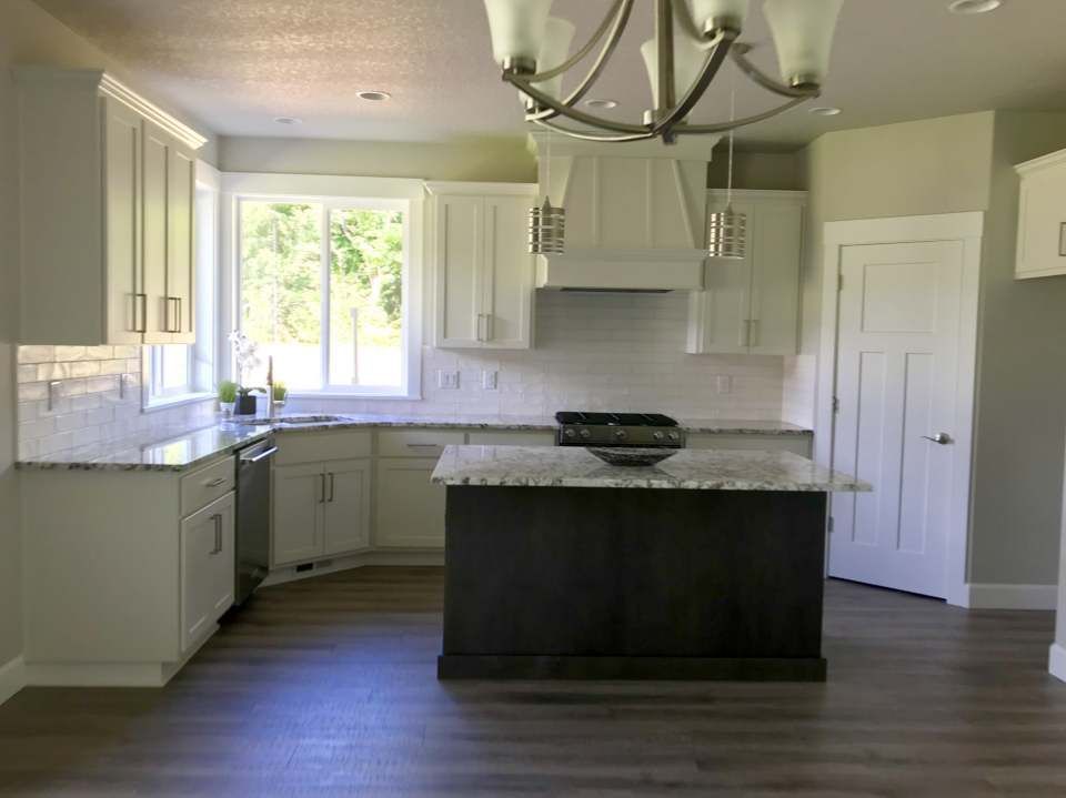 There is a large island in the middle of the kitchen.