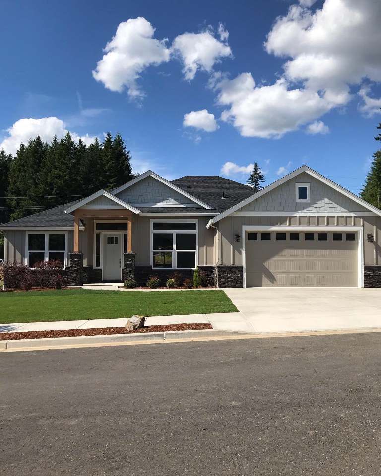 The front of a house with a large garage door