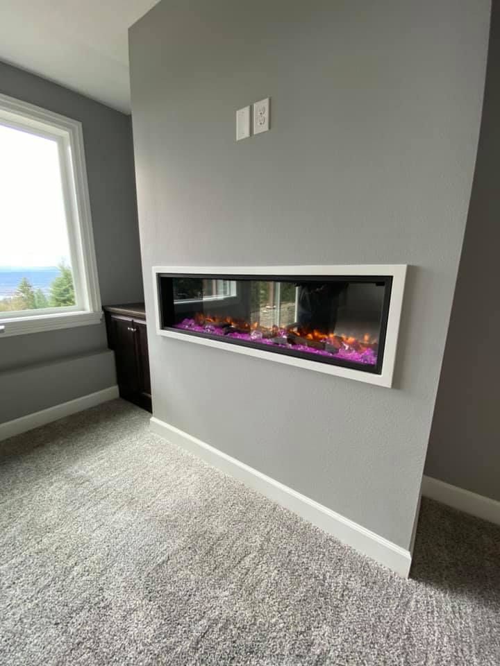 A fireplace is hanging on a wall in a room next to a window.