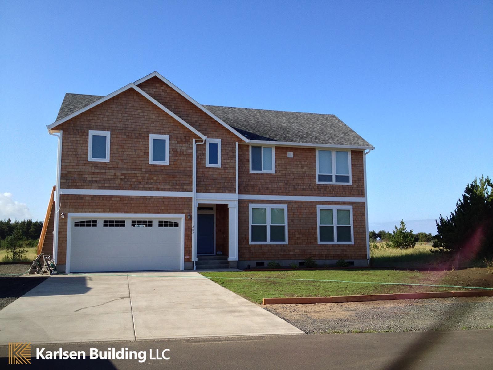 A large brick house is being built by karlsen building llc