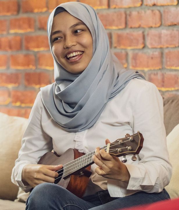 Woman playing ukulele