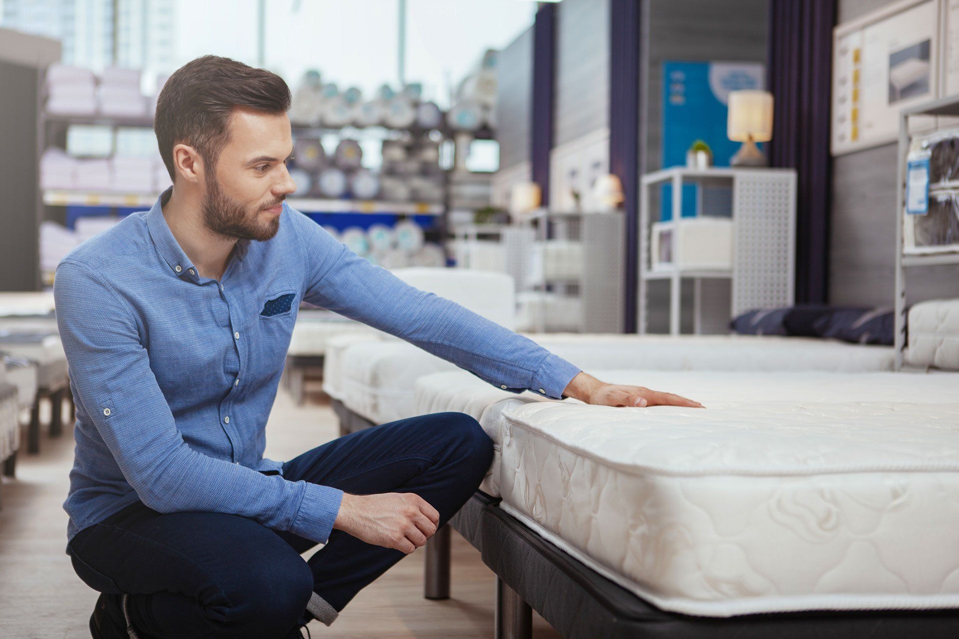 Handsome man shopping at furnishings store