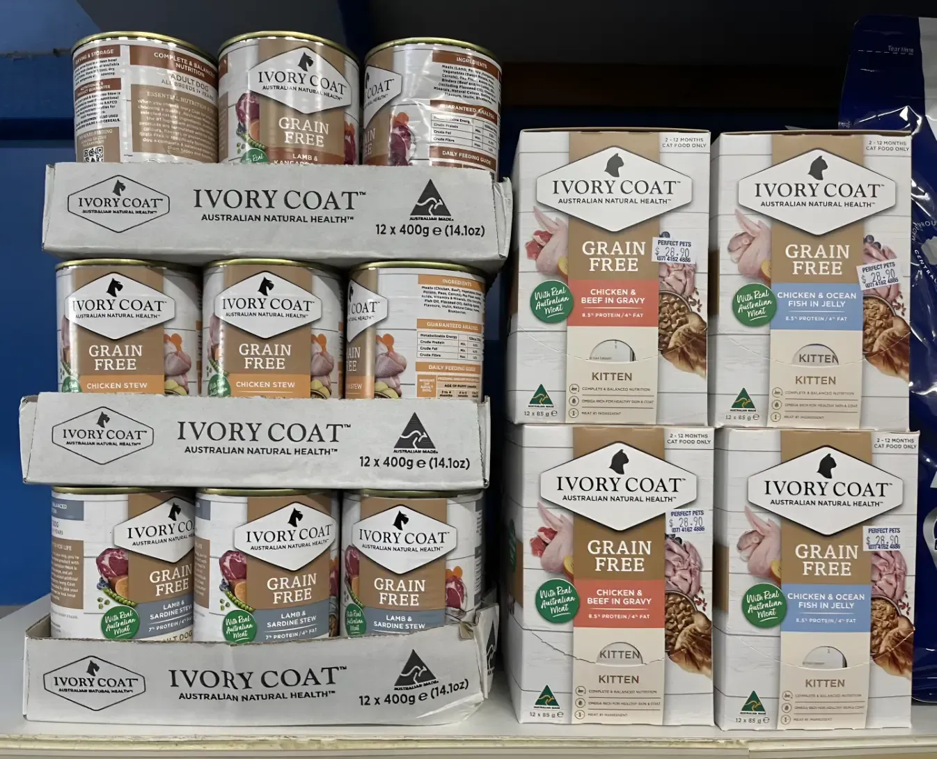A Shelf Filled With Cans and Boxes of Ivory Coat Dog Food — Perfect Pets Kingaroy Professional Dog Grooming in Kingaroy, QLD