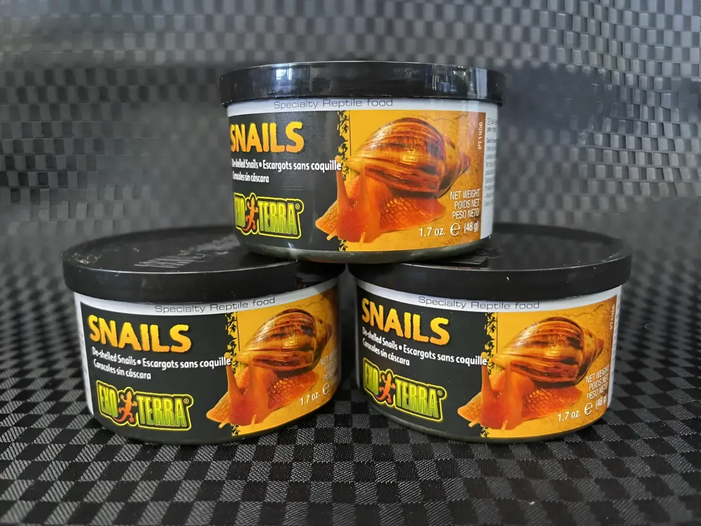 Three Cans of Snails Are Stacked on Top of Each Other — Perfect Pets Kingaroy Professional Dog Grooming in Kingaroy, QLD