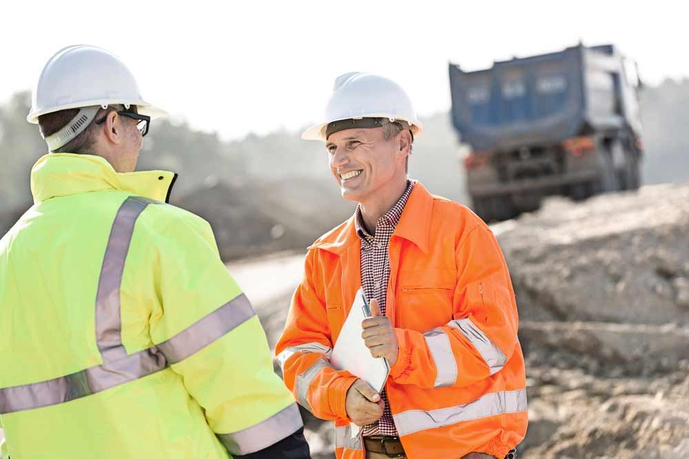 Engineer Talking To A Colleague At A Construction Site
