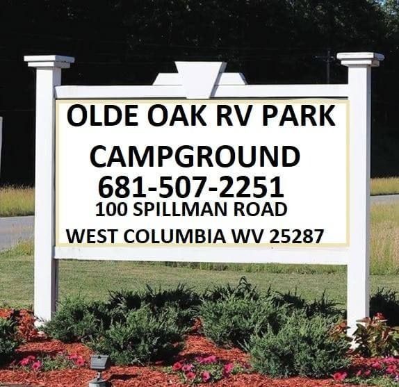 White sign for Olde Oak RV Park Campground with phone number and West Columbia, WV address