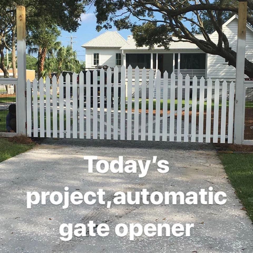 A white picket fence with the words today 's project automatic gate opener