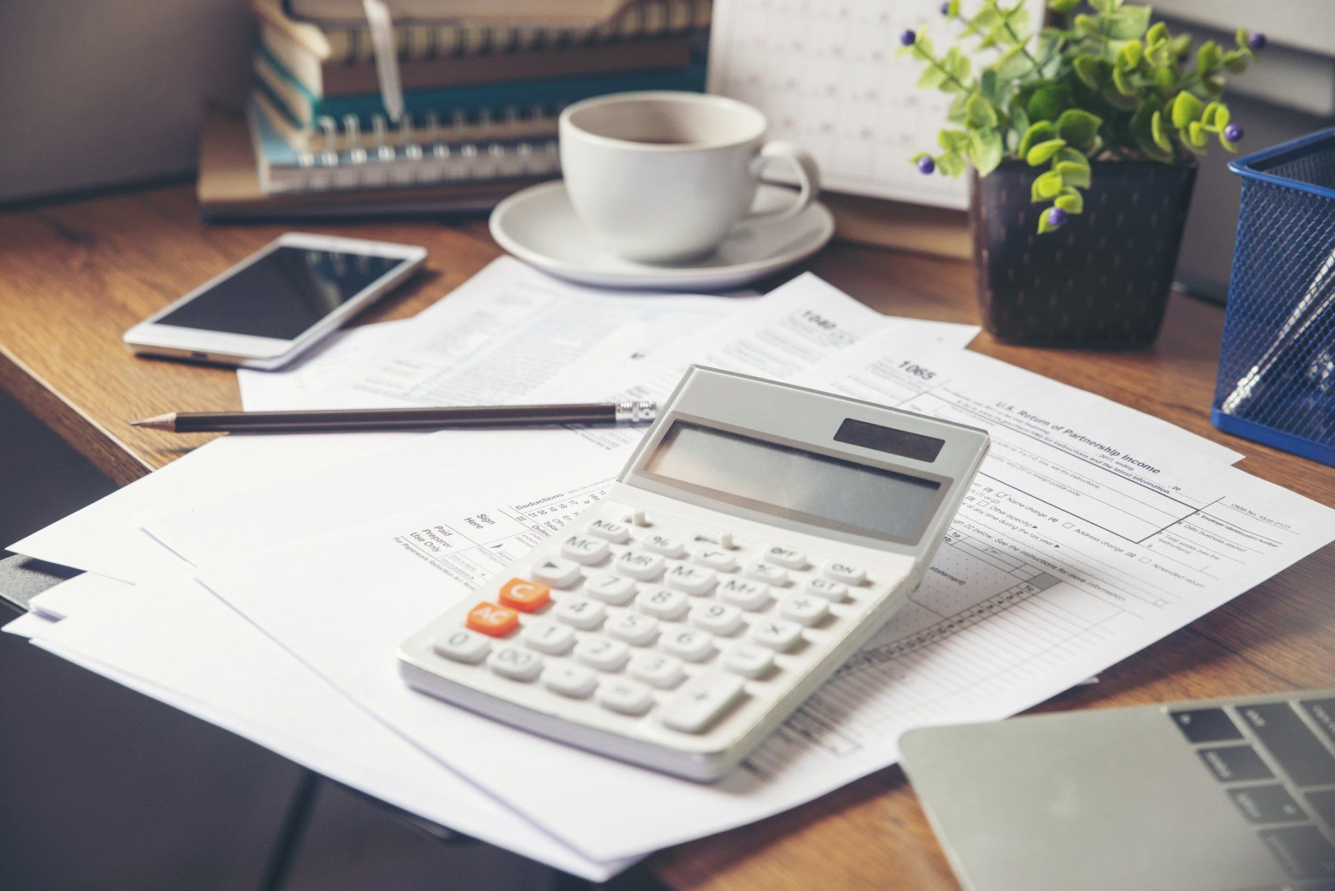 Calculator And Business Papers On Table — Oakbrook Terrace, IL — Kaczynski & Associates