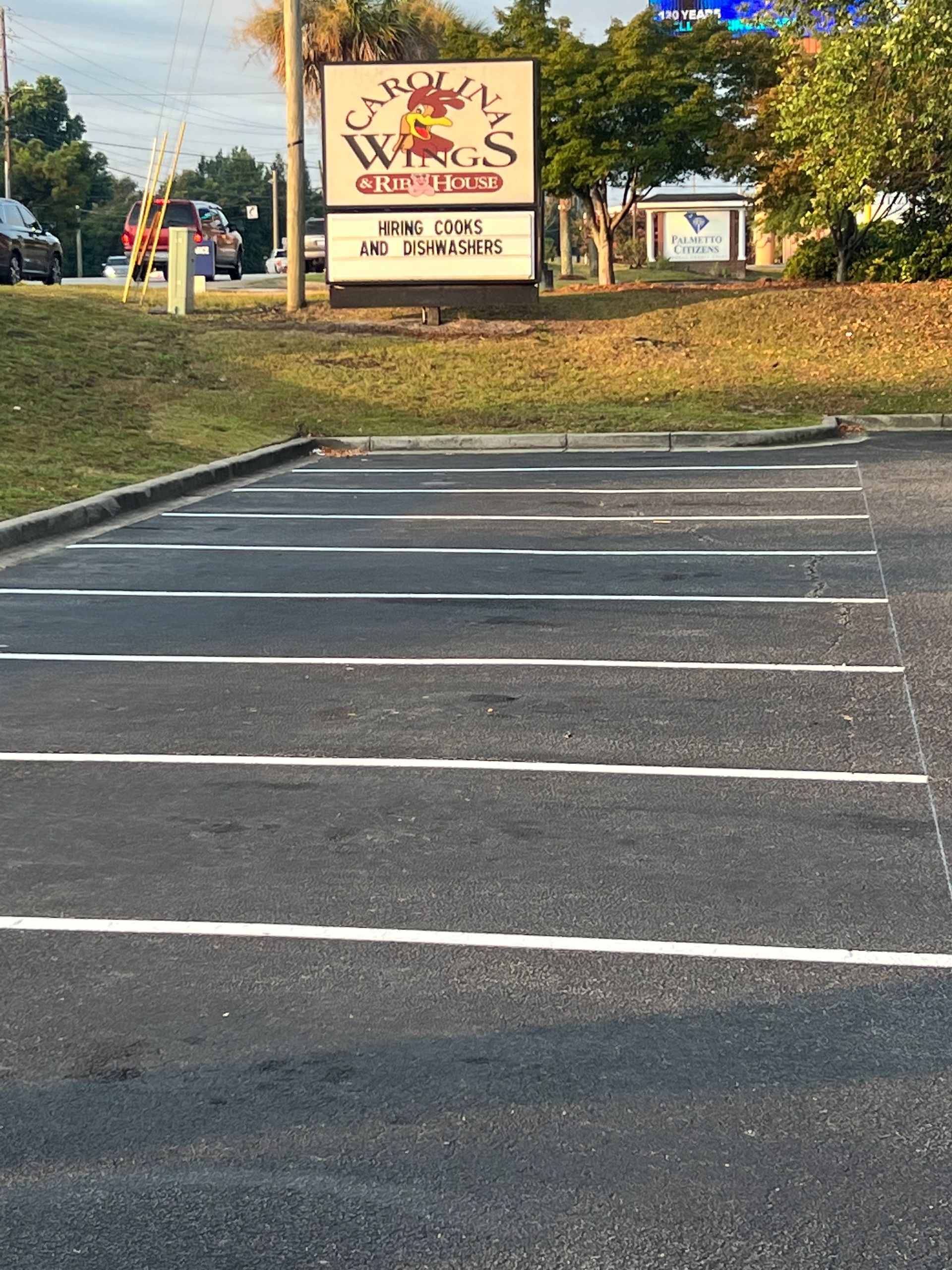 A parking lot with a sign that says smoke waves