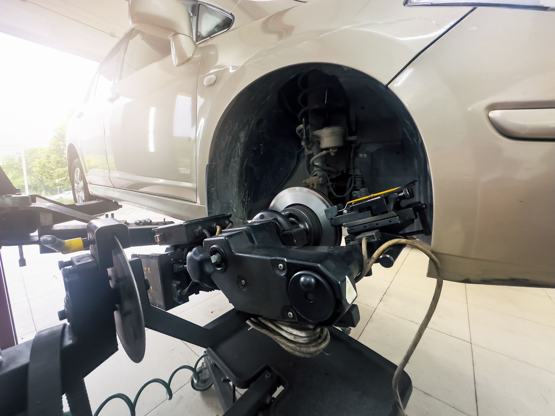 Car Wheel Aligned on a Machine in a Repair Shop — Enterprise Auto Repairs in Kunda Park, QLD