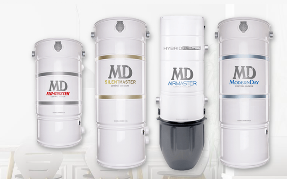 Four silver and white MD skincare product bottles lined up on a white background