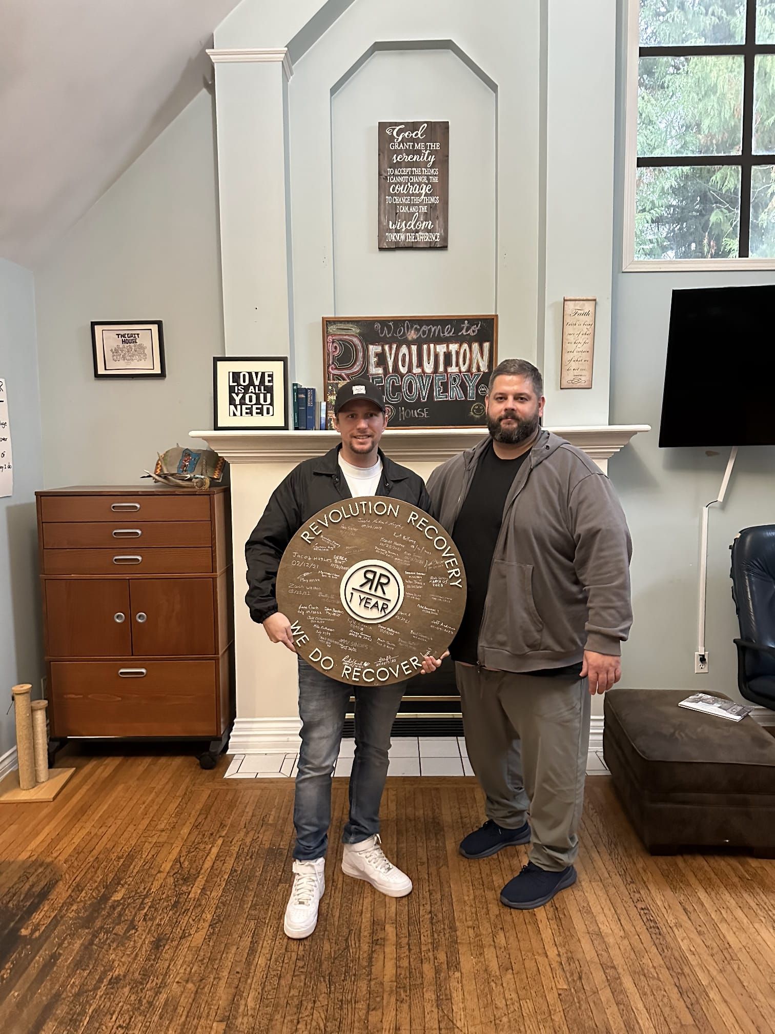 Photo of alumni and staff member celebrating one year sober