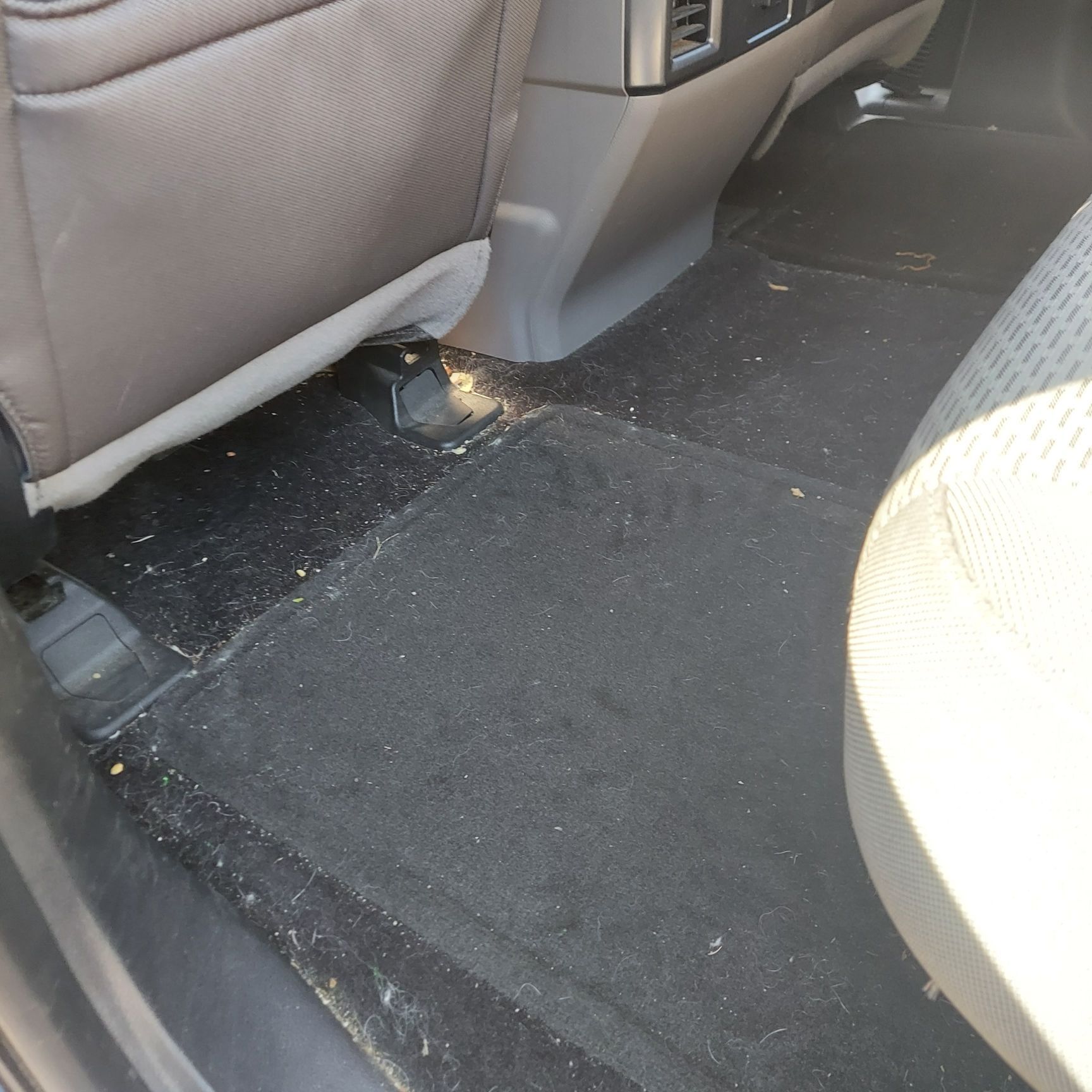 The inside of a car with a dirty floor | Ed's Automotive