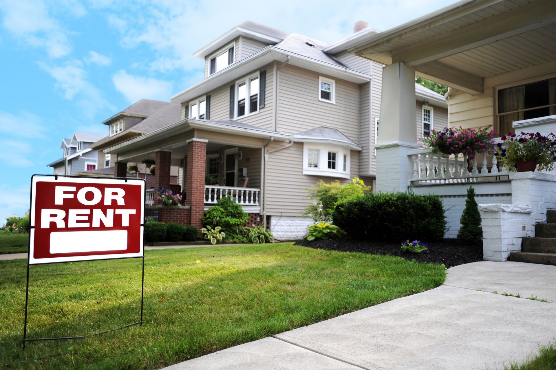 a for rent sign in a front yard