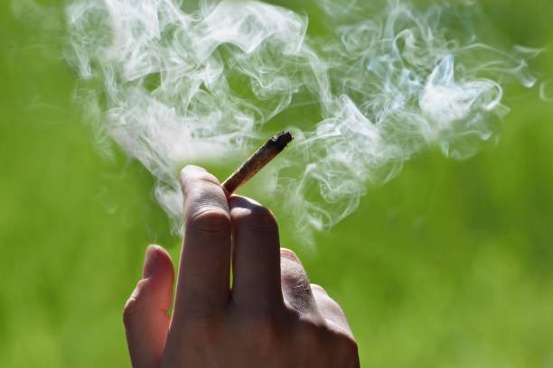 Someone smoking a joint