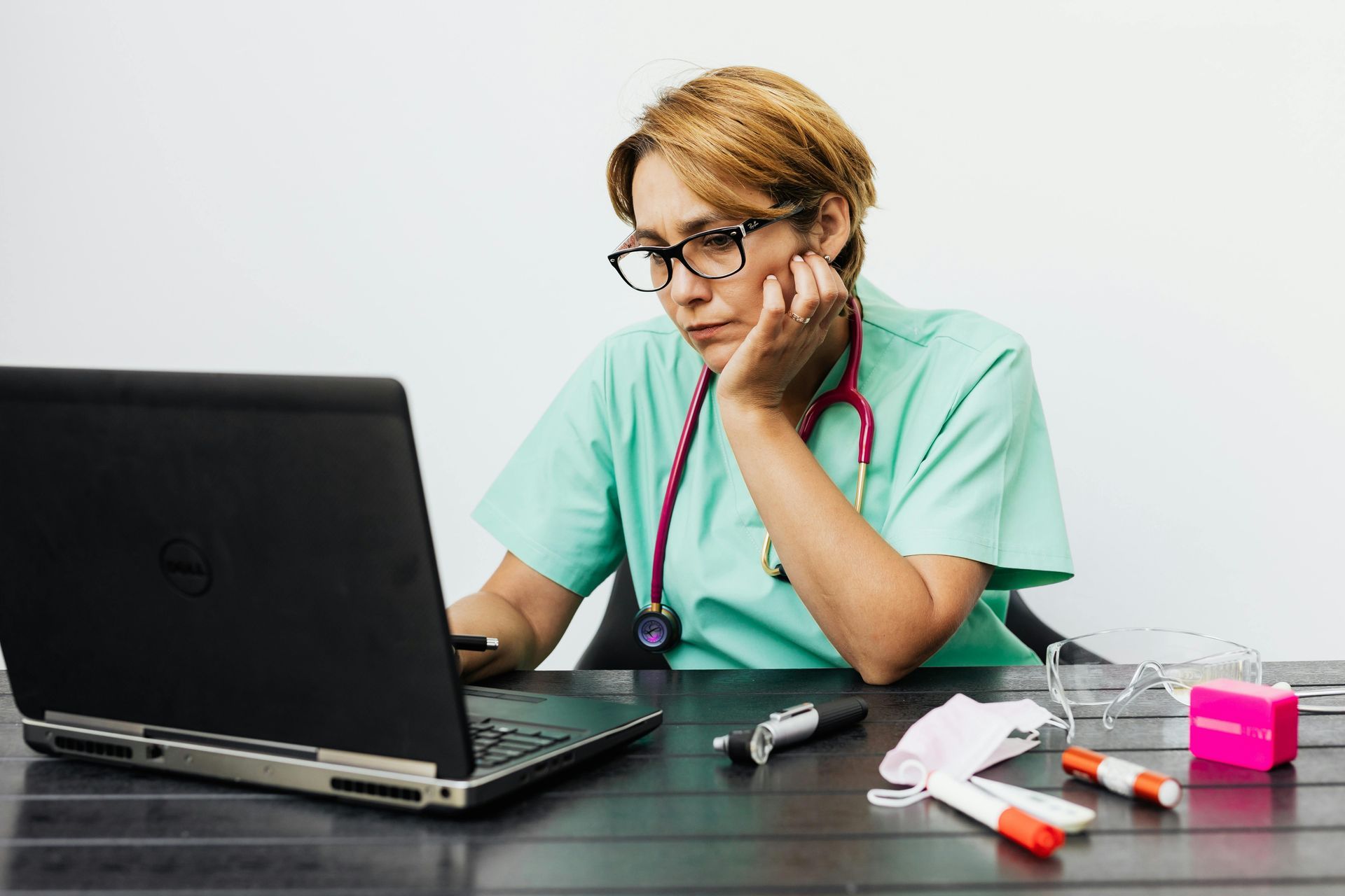 nurse working at a desk