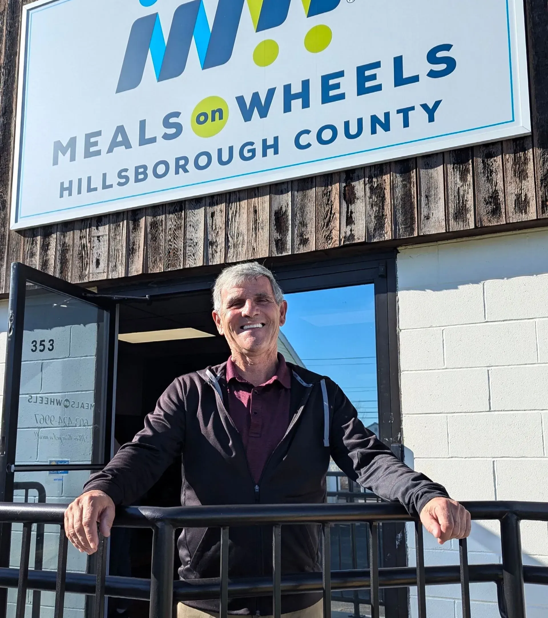 Man standing at entrance of Meals on Wheels in Hillsborough County.