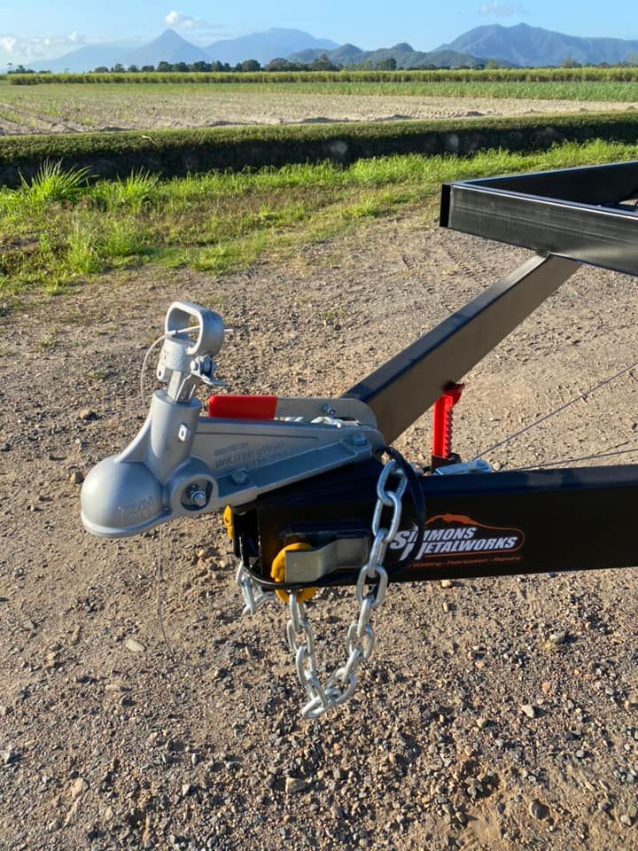 Silver Trailer Hook Suspended by a Crane - Professional Mobile Fabrication in Cairns