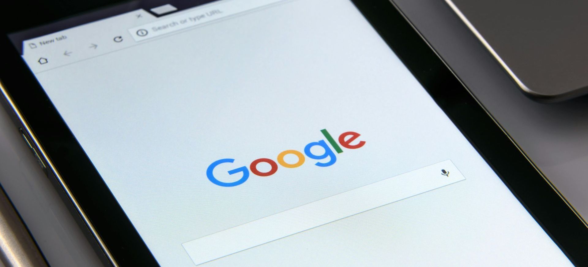 A tablet is open to a google search page.