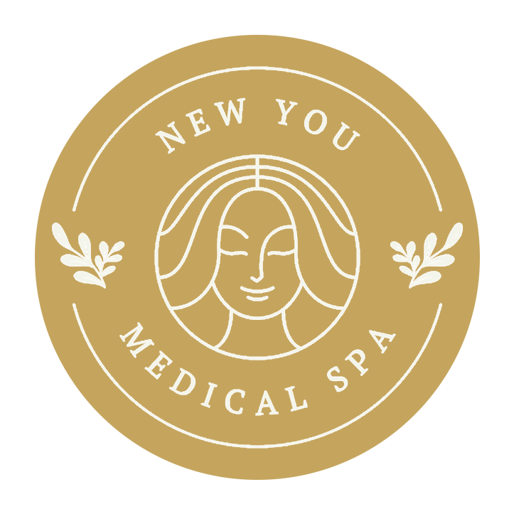 Gold circular logo for New You Medical Spa with stylized face and leaf accents