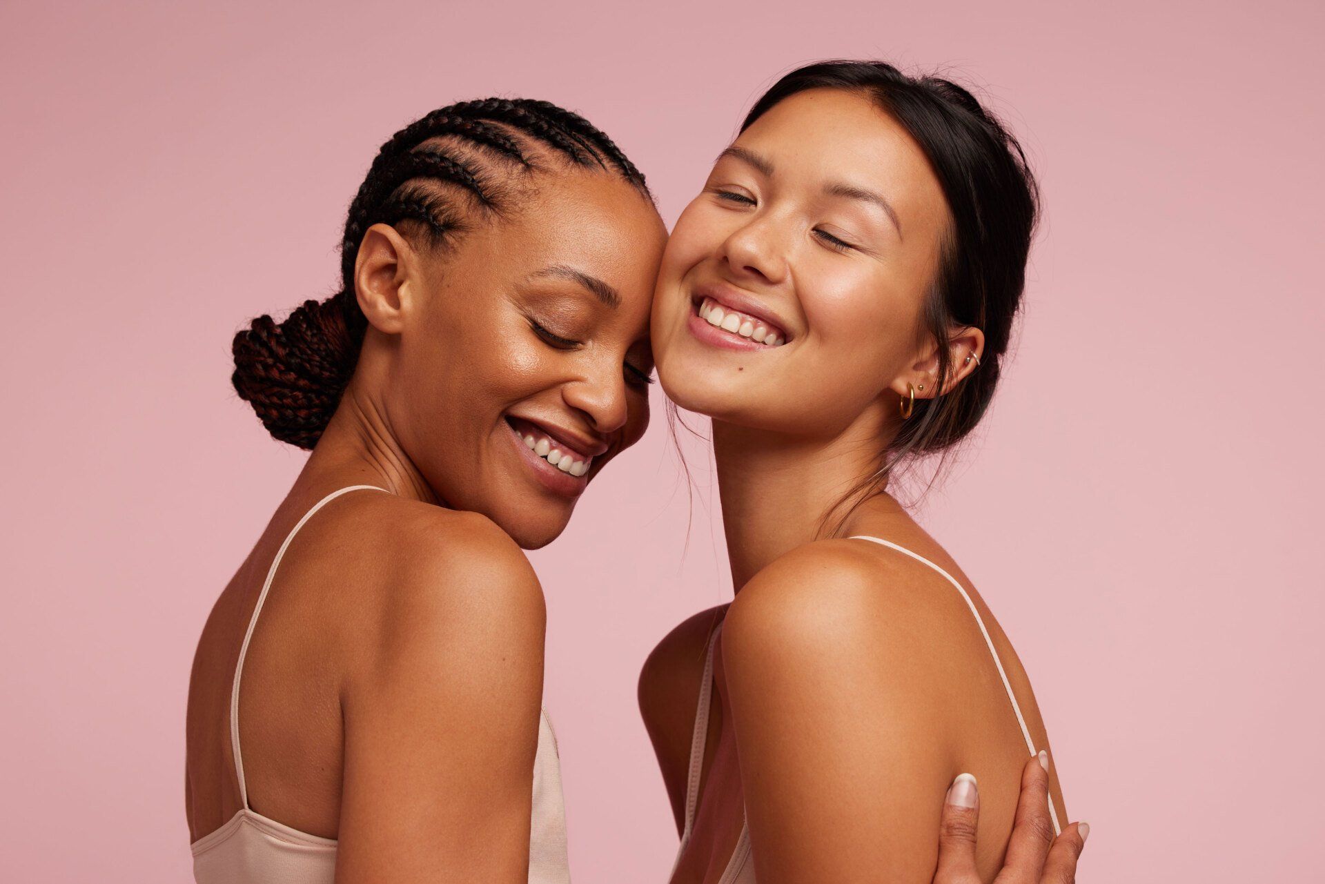 Black and asian women with glowing skin