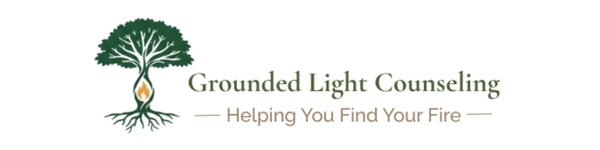 Logo of Grounded Light Counseling: A tree with roots, flame center, and text, 