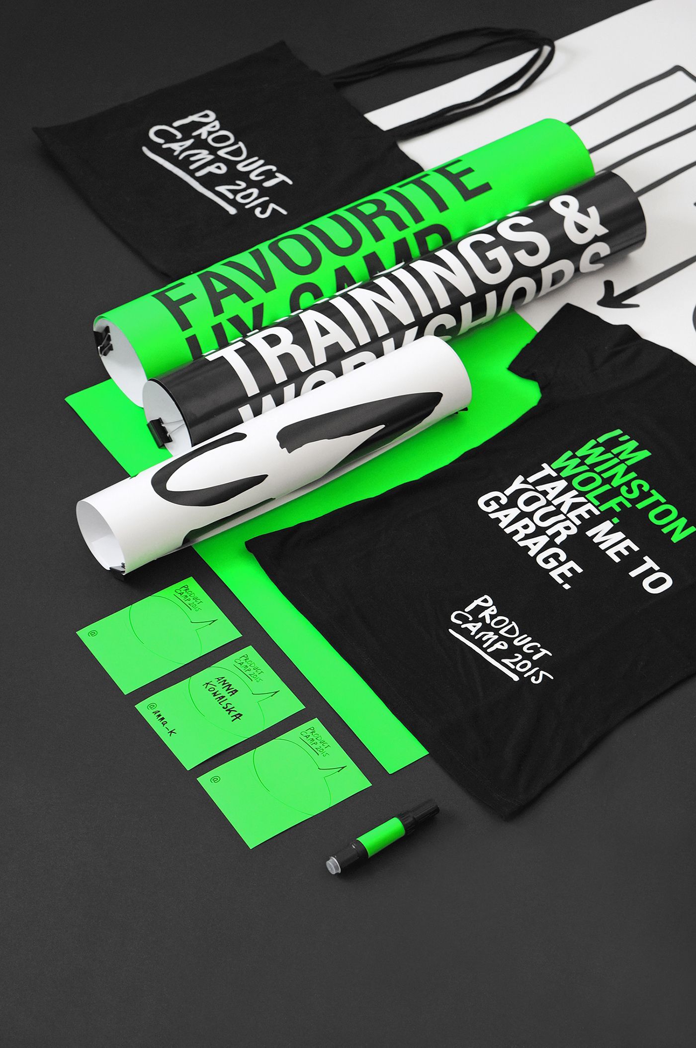 A bunch of green and black items are laying on a table.