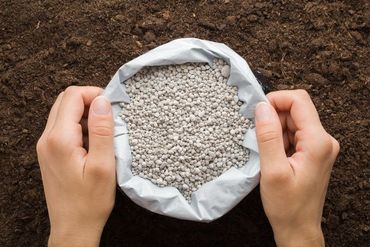 plastic bag with gray complex fertiliser granules