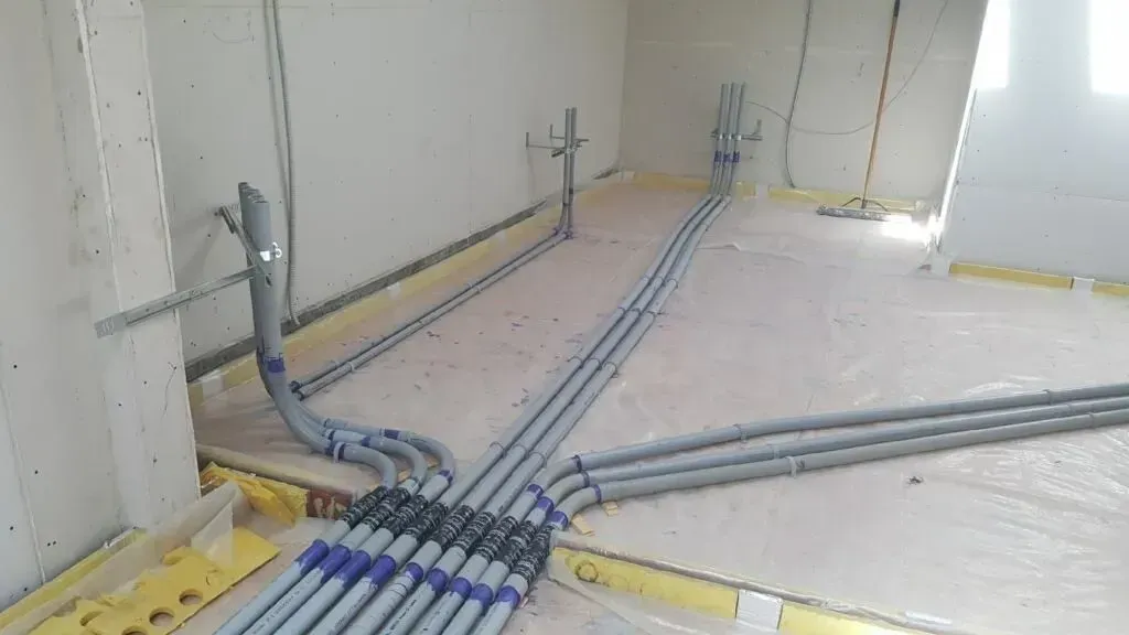 Electrical conduit and cable installation in new construction floor, Pico Rivera CA