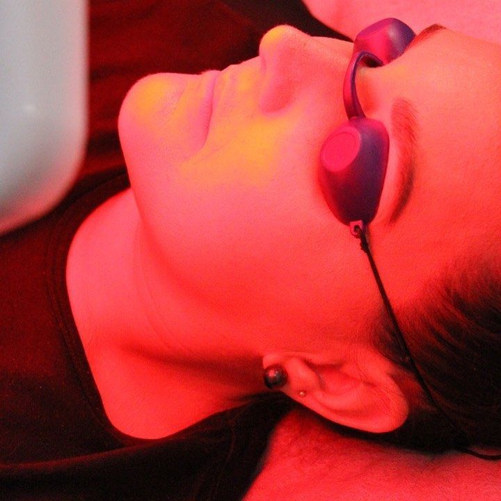 A Woman Wearing A Pair Of Goggles Is Laying Down With Her Eyes Closed — Beauty & Laser by Sarah in Long Jetty, NSW