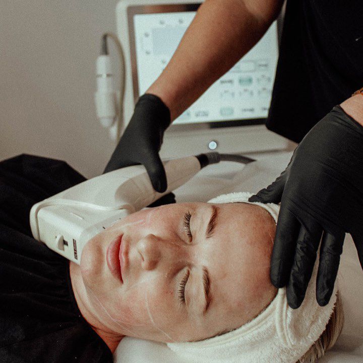 A Woman Is Getting A Facial Treatment In A Beauty Salon — Beauty & Laser by Sarah in Long Jetty, NSW