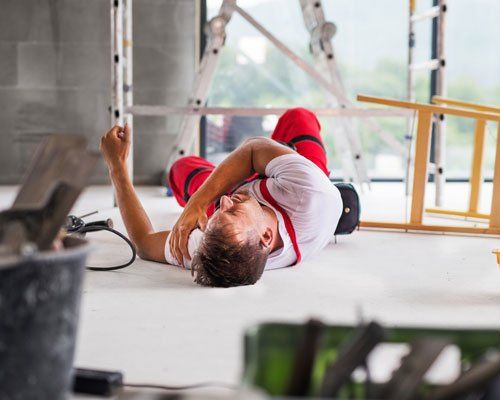 worker on the floor after falling off of ladder