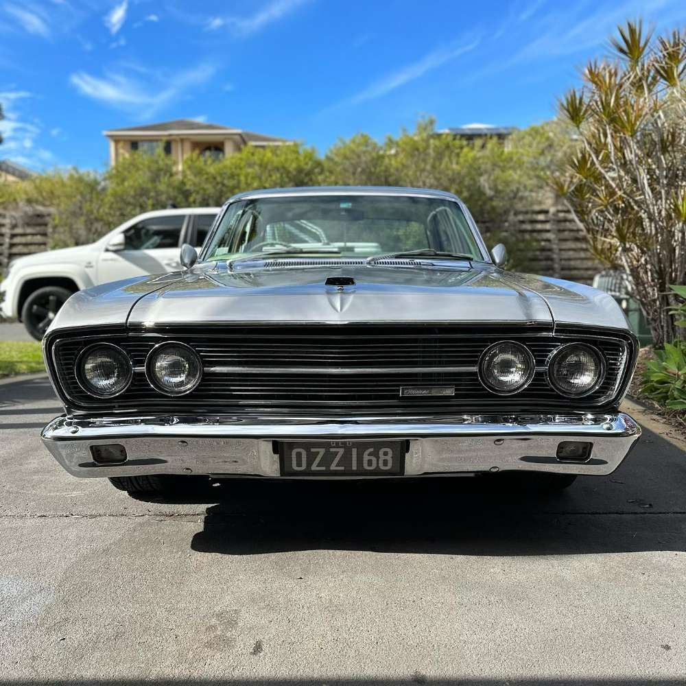 A Silver Vintage Car Parked on Open Space — Remedy Mobile Car Detailing in Gold Coast, QLD